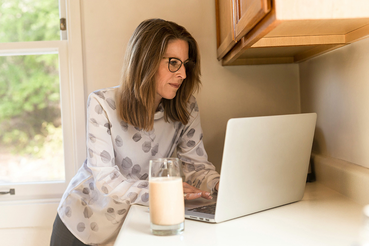 Unified Communications Industry Trends: a Woman by the Laptop is Working from Home