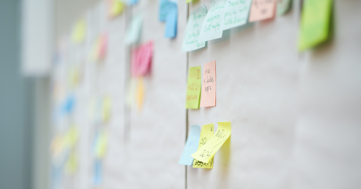Colourful sticky notes with things to do on office board